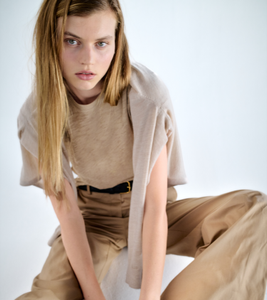 Model wearing tan ATM sweater
