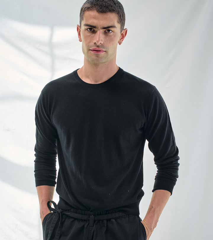 Model wearing black ATM sweater