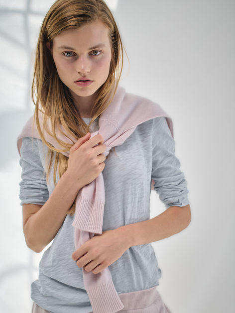 Model wearing ATM sweater and shirt